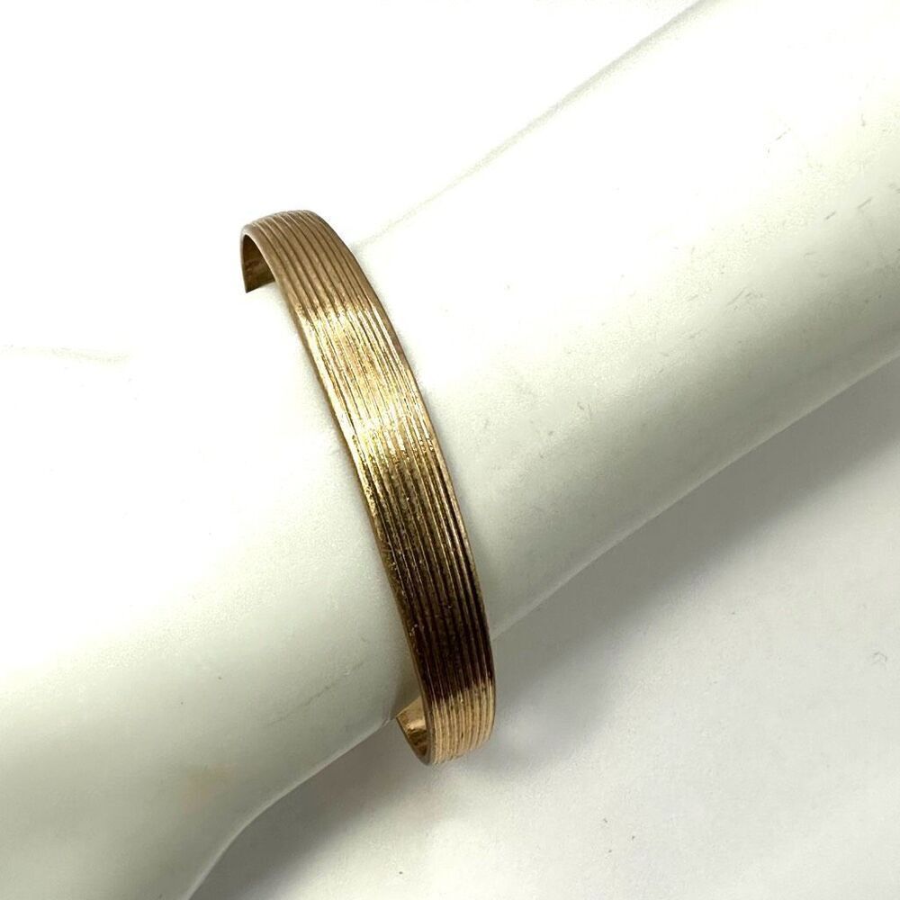 Small gold tone bangle bracelet